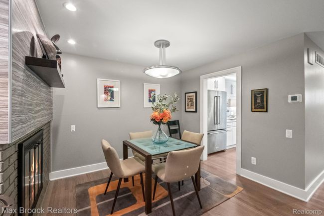 Formal dining room with shared fireplace. . . | Image 13