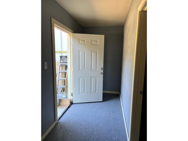 Corridor featuring a water view | Image 12