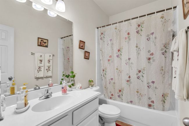Bathroom with vanity and shower / tub combo with curtain | Image 5