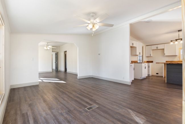 The family room flows seamlessly into the kitchen and living room, creating an open, inviting space that’s perfect for gathering, entertaining, or just enjoying everyday life. | Image 6