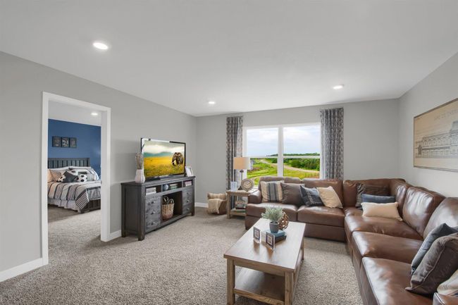 The upper level loft is a great space to unwind, read books or watch TV. Model photos. Options and colors will vary. | Image 19