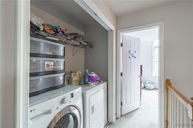 Laundry area with washer and clothes dryer and light carpet | Image 15