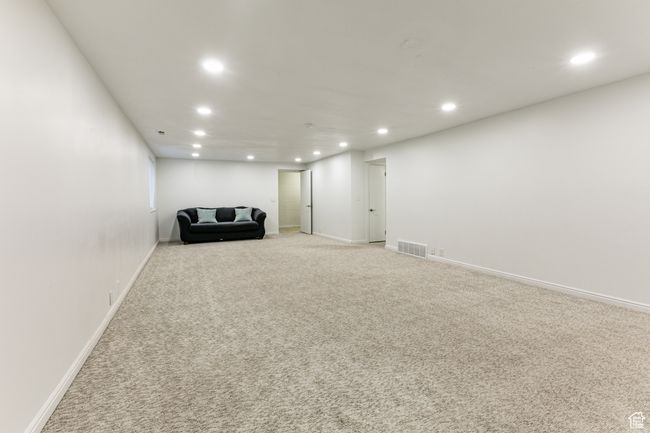 Unfurnished room with recessed lighting, light colored carpet, and baseboards | Image 25
