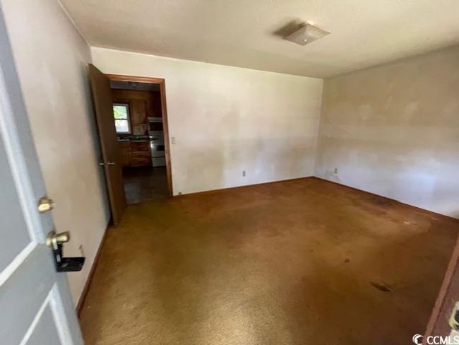 View of carpeted spare room | Image 8