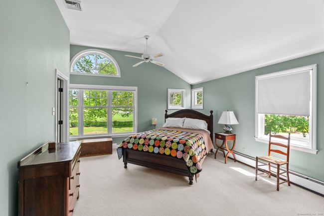 Primary suite with cathedral ceilings. | Image 27