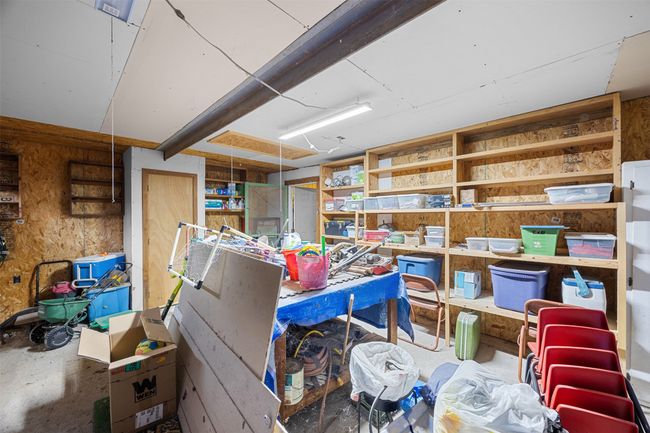View of storage room, room for an upright freezer and refrigerator. Plus lots of shelfing | Image 17