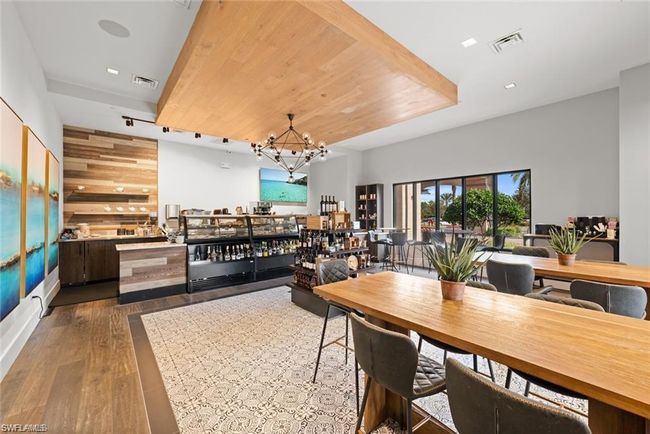 Dining room featuring a notable chandelier, visible vents, and dark wood-style floors | Image 33