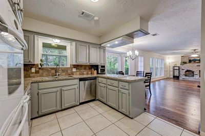 Kitchen open to the living area. | Image 1