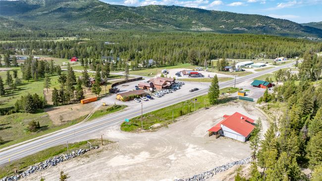 Aerial view of a heavily wooded area and mountains | Image 94