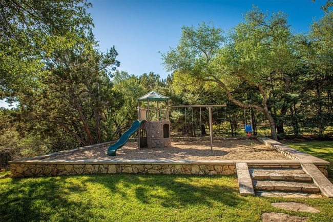 Communal playground featuring a yard | Image 36