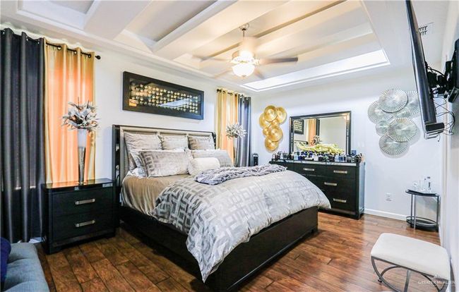 Bedroom featuring ceiling fan and dark wood-type flooring | Image 19