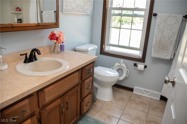 Bathroom featuring vanity and tile patterned floors | Image 37
