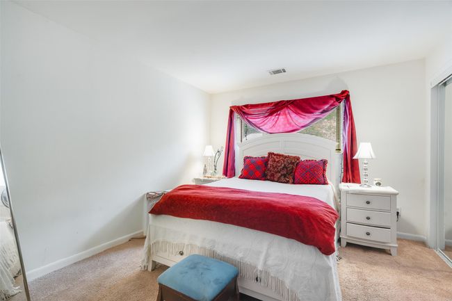 Bedroom with light colored carpet | Image 12