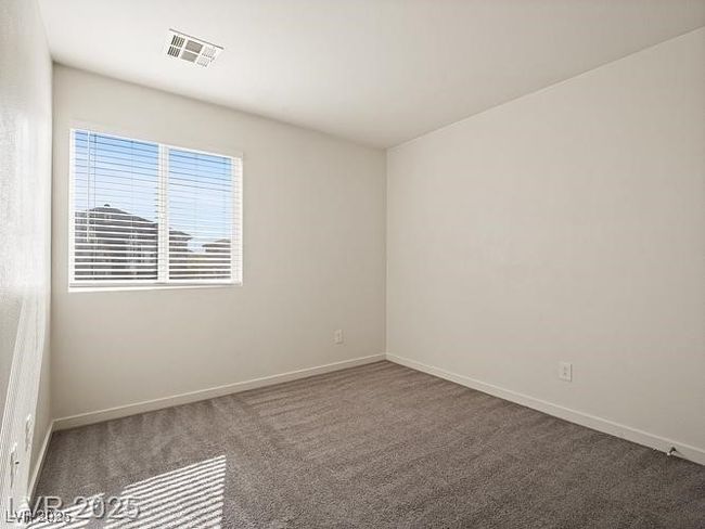 Unfurnished room featuring carpet and baseboards | Image 14