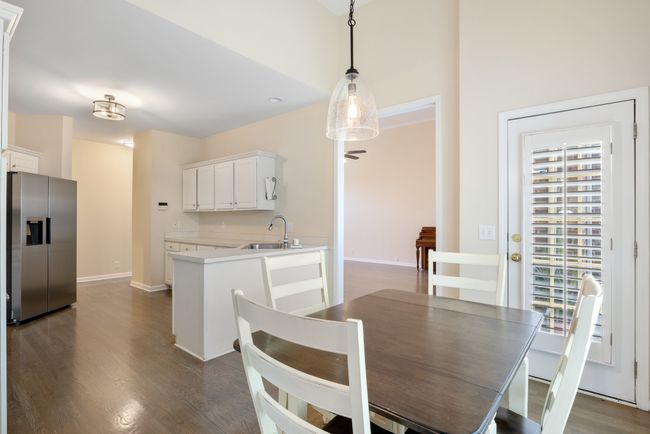 Kitchen and eat-in dining open onto deck for easy entertaining and grilling | Image 11