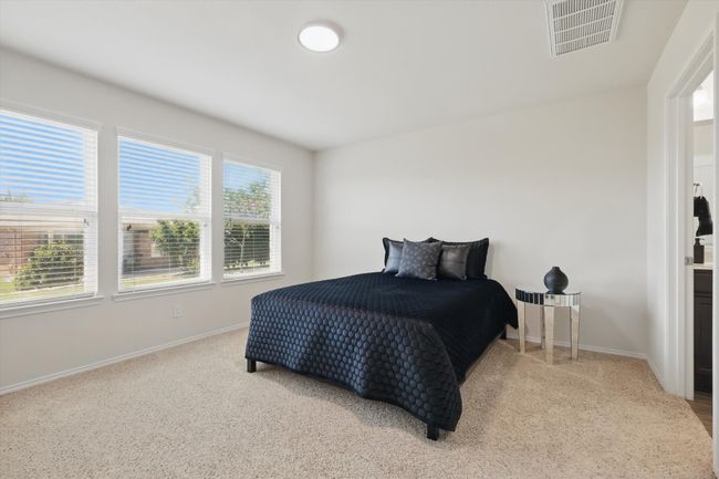 Primary Carpeted bedroom featuring Ensuite Bathroom | Image 15