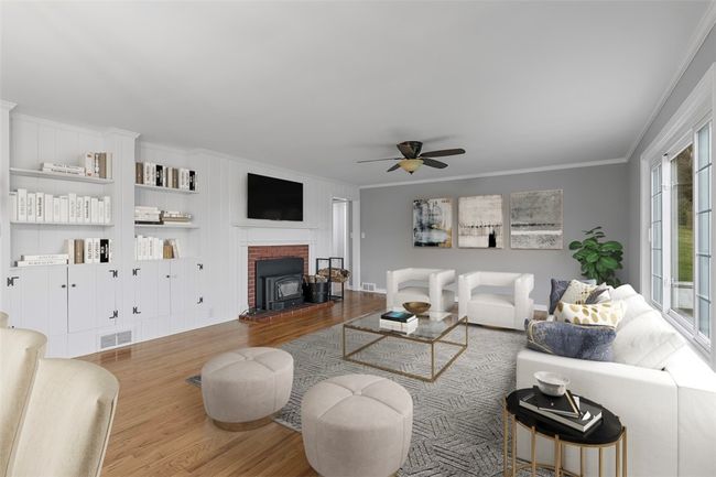 A fireplace adds an element of coziness to the space. | Image 22