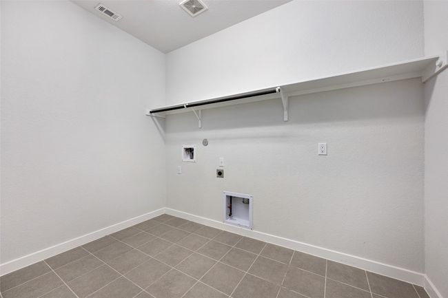 Laundry room with electric dryer hookup, hookup for a gas dryer, and washer hookup | Image 27