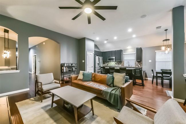 Cozy living room with gas fireplace and surround sound. | Image 13