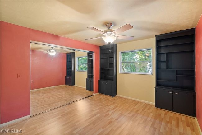 Bedroom with ceiling fan and light hardwood / wood-style flooring | Image 18