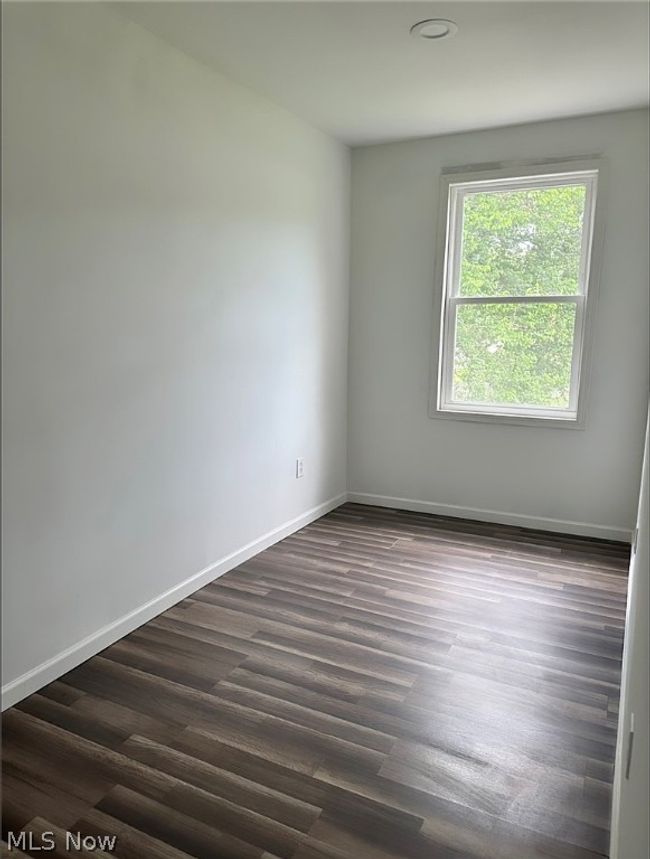 Empty room with dark hardwood / wood-style flooring | Image 12