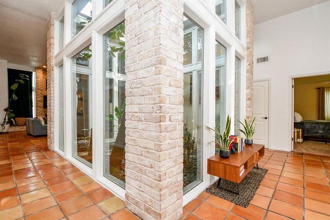 Attentively and beautifully confined, the thriving, relaxing presence of nature is just footsteps from living and common areas. | Image 10