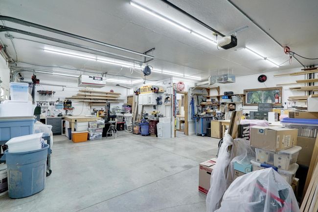 Room for any vehicles or hobbies - the possibilities are endless for this heated and air conditioned space. | Image 39