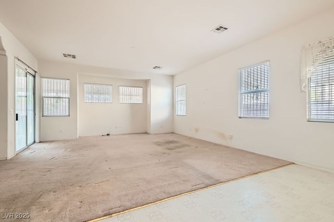 Empty room with carpet and visible vents | Image 12