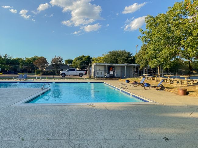 Community pool with a patio | Image 36