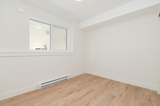 Unfurnished room with a baseboard heating unit and light wood-style floors | Image 35
