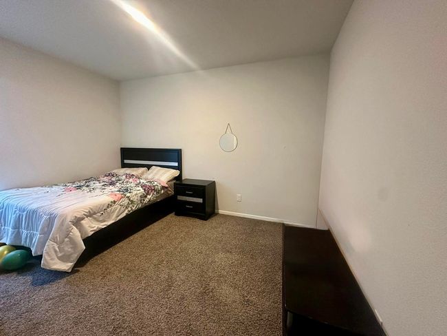Carpeted bedroom featuring baseboards | Image 11