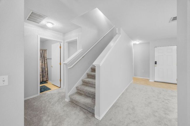 The newly carpeted stairs take you to the second level where you will find a bonus room and 3 bedrooms. | Image 14