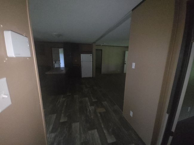 Hallway featuring dark wood-type flooring | Image 11