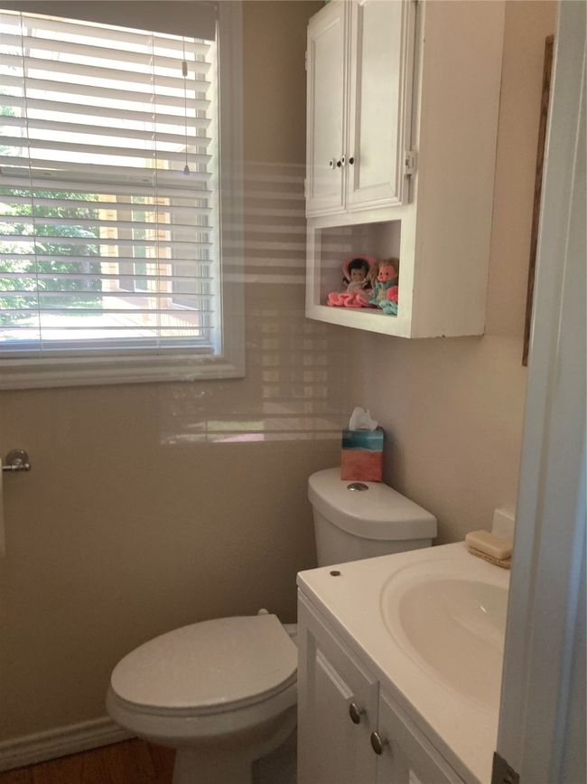 Bathroom featuring vanity and toilet | Image 29