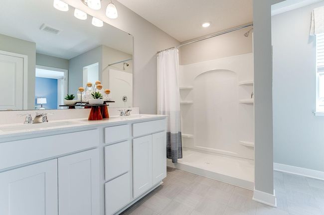 Another view of the primary bath. Photo of model home, color & options may vary. | Image 18