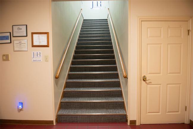 Staircase featuring baseboards and tile patterned floors | Image 15