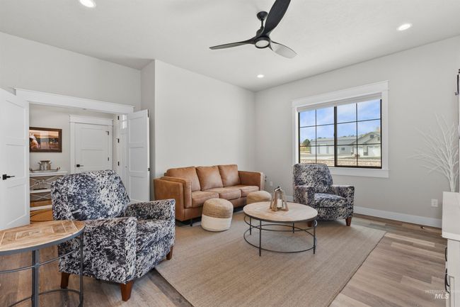 Living room with wood finished floors, a ceiling fan, and recessed lighting | Image 8