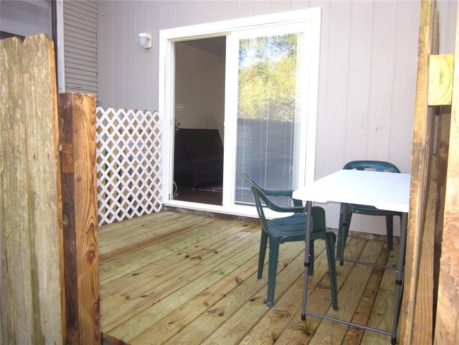 Sliding doors lead to outdoor deck and patio of Guest Suite B | Image 48