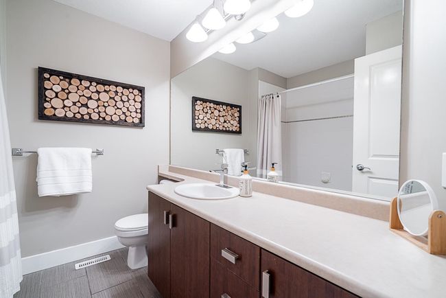Bathroom with vanity and a shower with curtain | Image 26