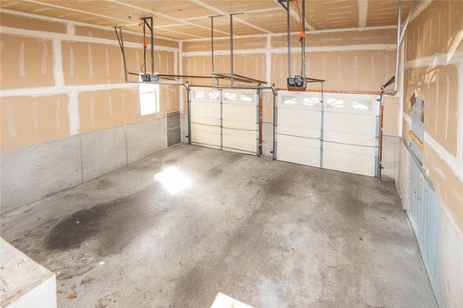 Garage with a garage door opener | Image 26