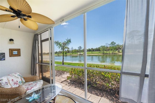 Sunroom featuring a water view and ceiling fan | Image 18