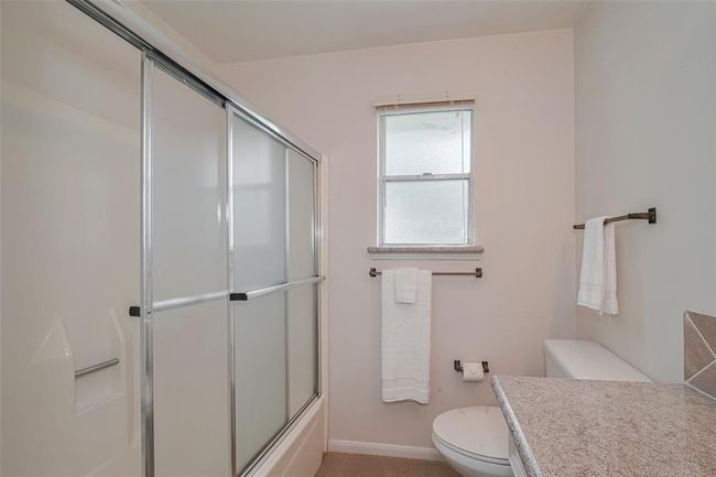 Guest bathroom with a versatile tub/shower combo. | Image 29