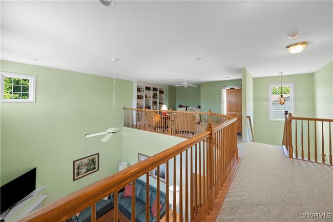 Hallway featuring an upstairs landing and carpet flooring | Image 30