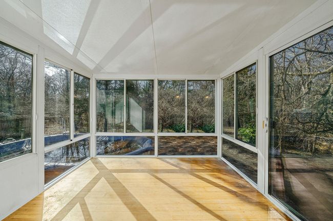View of unfurnished sunroom | Image 14