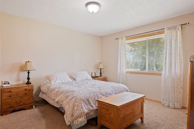 Carpeted bedroom featuring baseboards | Image 30