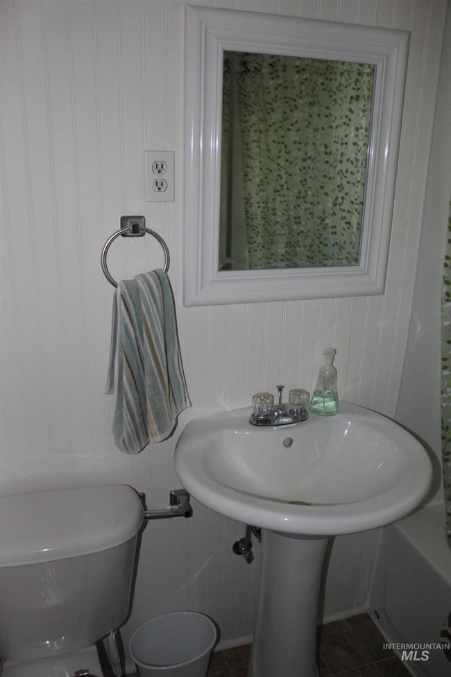 Bathroom featuring toilet and tile patterned flooring | Image 11