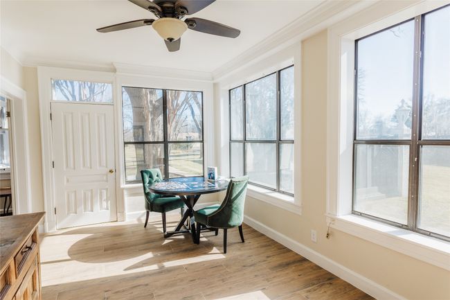 Sunroom featuring ceiling fan | Image 15