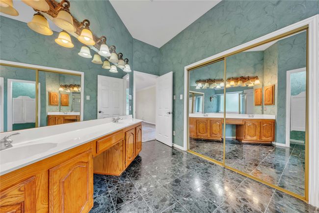 Full bath with two vanities and wallpapered walls | Image 16