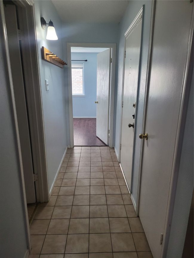 Corridor with baseboards and light tile patterned floors | Image 5