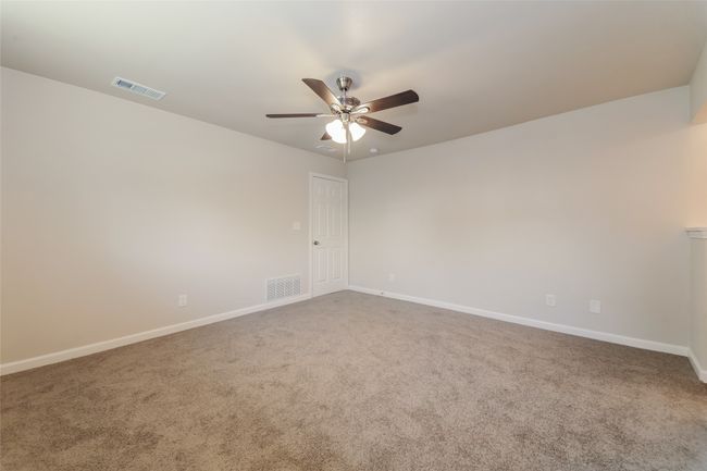 Unfurnished room featuring a ceiling fan and carpet | Image 18